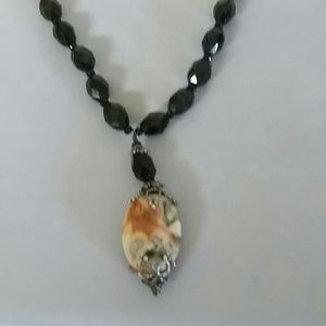 Stone and glossy black necklace